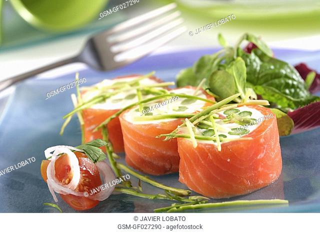 Smoked salmon rolls with cheese cream and asparagus