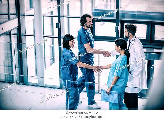 Surgeons shaking hands with each other