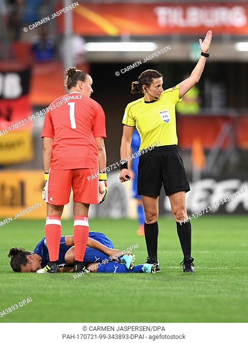 Ilaria Mauro from Italy lies injured on the ground while German goalkeeper Almuth Schult and referee Kateryna Monzul look on during the women's European Soccer...