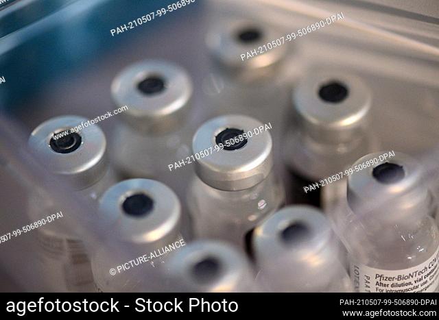 07 May 2021, Saxony-Anhalt, Halberstadt: Empty vials from which the vaccine from Biontech-Pfizer was vaccinated stand in a small box
