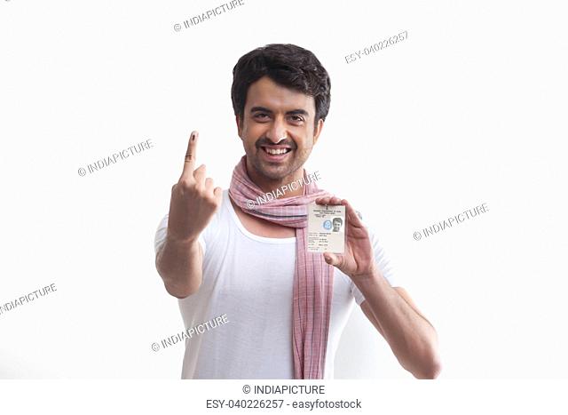 Farmer with voters mark and identity card