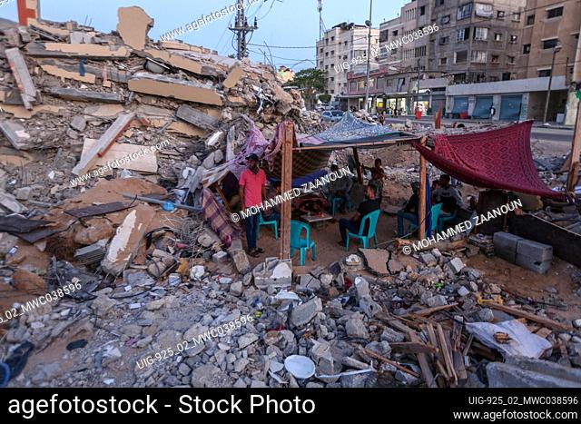 A Palestinian family lives in a tent on the rubble of their destroyed home in the northern Gaza Strip. Gaza City