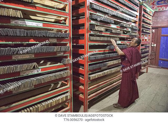 Rows of handmade woodblock Buddhist scripture prints filed inside the holy Bakong Scripture Printing Press Monastery in Dege, Sichuan, China