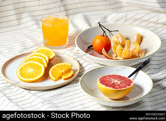 mandarin, grapefruit and glass of orange juice