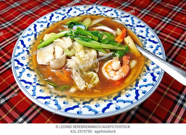 Noodles in Chinese brown sauce with seafood. Krabi Province, Thailand