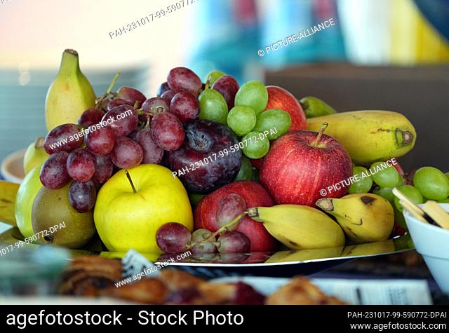 16 October 2023, Berlin: A plate of fruit stands on a table converted into a buffet during the opening. Photo: Soeren Stache/dpa