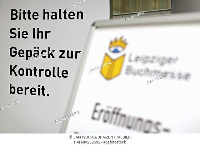 A sign that reads 'Please have your luggage ready for inspection' seen prior to the opening of the book fair in Leipzig,  Germany, 22 March 2017