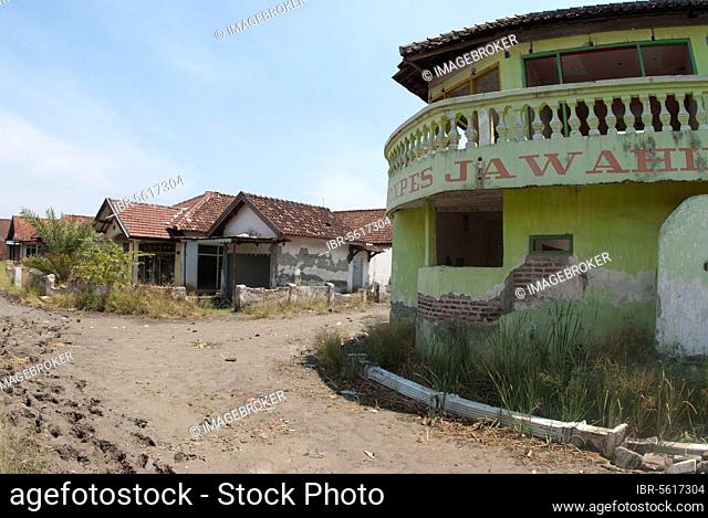 Abandoned village in dried mud after mud volcano flooded by mud lake, environmental disaster that developed after drilling incident, Porong Sidoarjo