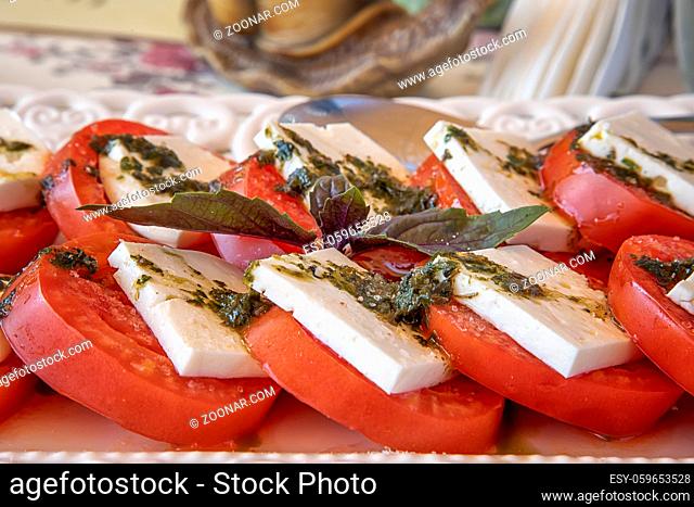 Traditional Italian Caprese salad on the plate. Close view