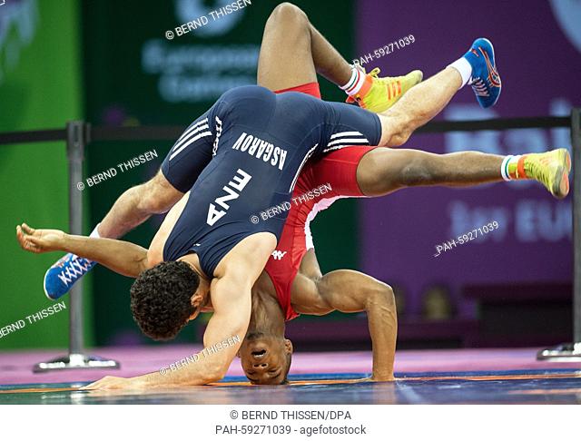 Chamizo Marquez from Italy (red) competes with Togrul Asgarov (blue) of Azerbaijan in the wrestling Men's 65kg Freestyle Final at the Baku 2015 European Games...