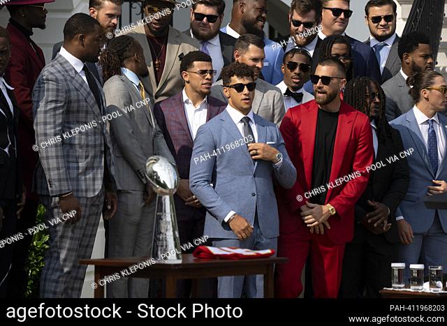Members of the Kansas City Chiefs including quarterback Patrick Mahomes(light blue suit) and tight end Travis Kelce(red suit) arrive at a ceremony honoring...