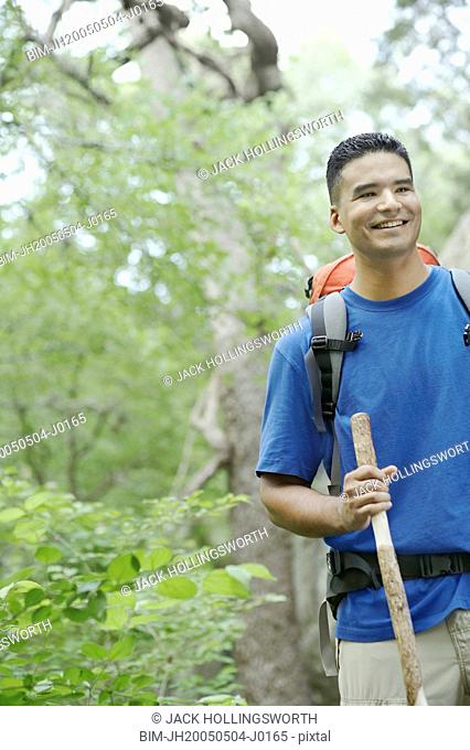 Young man hiking in a forest