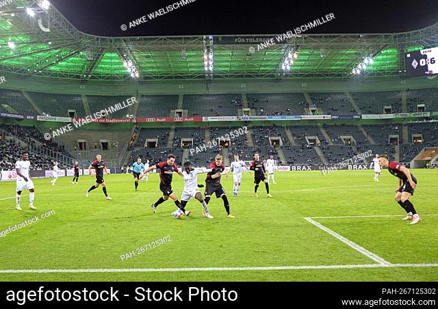 Game scene in Borussia-Park, left to right Nicolas HOEFLER (Höfler, FR), Kouadio KONE (MG), Lukas KUEBLER (KÃ-bler, FR), in the background the scoreboard with...
