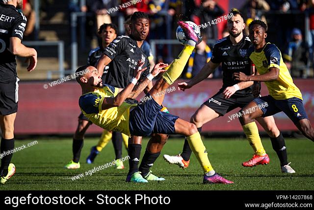 Eupen's Emmanuel Agbadou and Union's Loic Lapoussin fight for the ball during a soccer match between Royale Union Saint-Gilloise and KAS Eupen