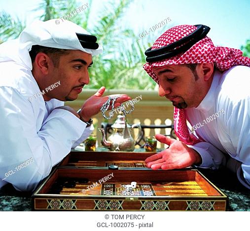 Arab men playing backgammon