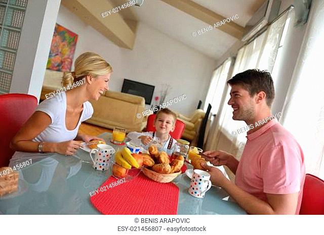 family have healthy breakfast at home