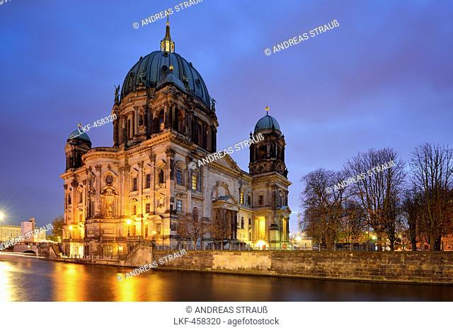Illuminated Berlin cathedral above the river Spree, Berlin, Germany