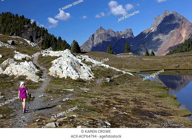 Young Girl Hiking Towards American Border Peak, Yellow Aster Butte Trail, Mount Baker Wilderness, Washington State, United States of America