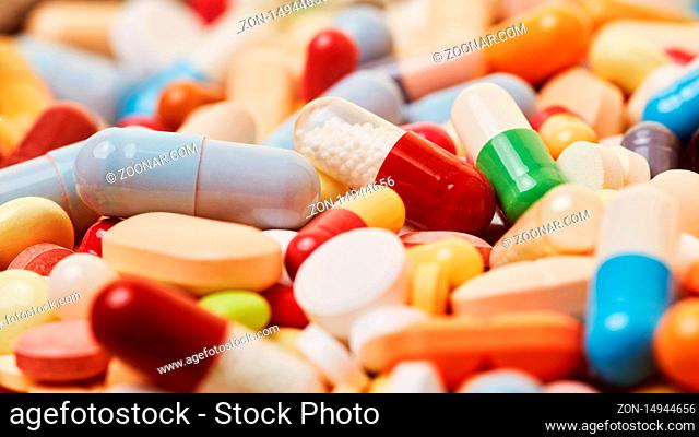 Viele bunte Tabletten und Pillen als Medikamente Konzept Hintergrund