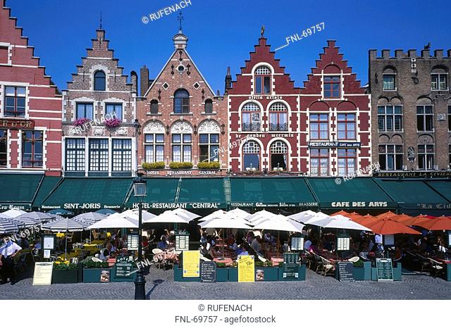 Cafes and restaurants in front of row houses, Grand Place, Bruges, Belgium