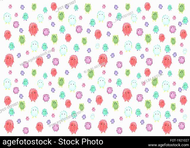 Childs drawing tiny cute multicolor monsters on white background