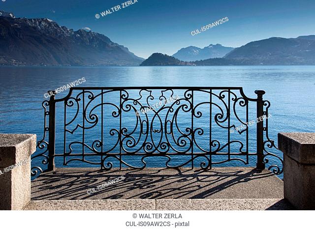Ornate sunlit iron gate, Lake Como, Italy