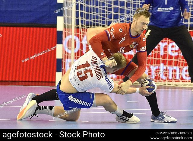 Jonas Gunnarsson Djurhuus of Faroe Islands, left, and Dominik Solak of Czech Republic in action during the European men’s handball championship qualification...