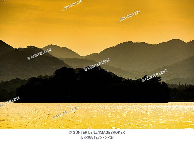 Hills at West Lake at sunset, Xihu, Hangzhou, Zhejiang Province, China