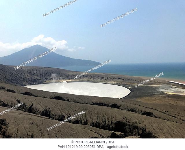 17 October 2019, Indonesia, Krakatau: A view on the lake of the Indonesian volcano Anak Krakatau, with the volcano Krakatau in the background