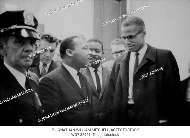 USA -- 26 Mar 1964 -- Martin Luther King and Malcolm X waiting for a press conference to begin -- Picture by Marion Trikosko / Lightroom Photos
