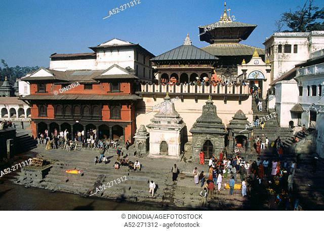 Cremation ghats on the banks of Bagmati River, Lord Shiva Pashupatinath Hindu Temple, Katmandu, Nepal