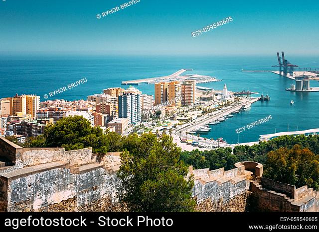 Malaga, Spain. Elevated View, Cityscape View Of Malaga, Spain. Old Fort Walls And Residential Houses