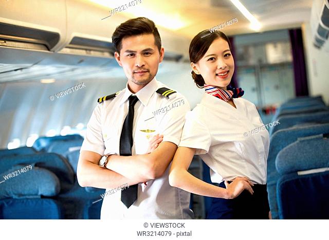 Two flight attendants in the cabin