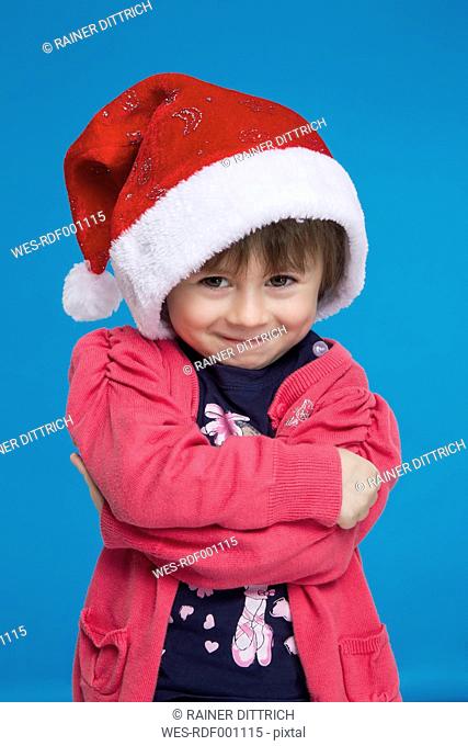 Portrait of girl with santa hat, smiling