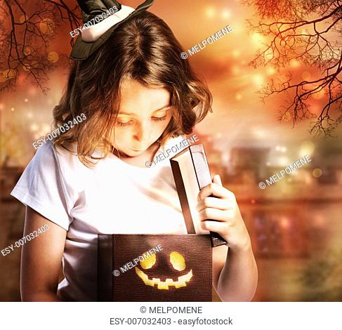 Halloween Cute Little Witch Opening a Box