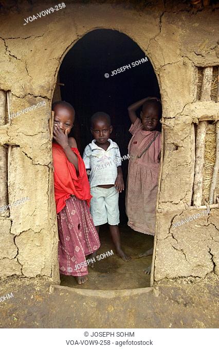 Children at door in village near Tsavo National Park, Kenya, Africa