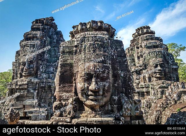 Ancient stone faces of Bayon temple, Angkor, Cambodia, Asia
