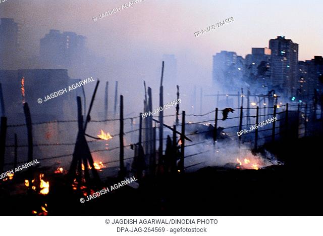 Slums burning in fire, Colaba, Mumbai, Maharashtra, India, Asia
