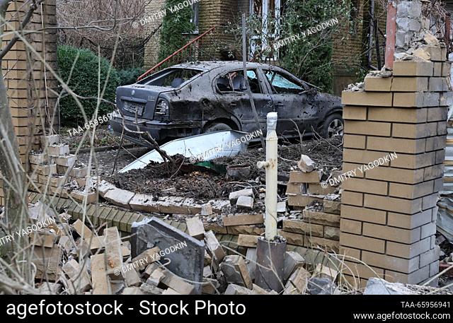 RUSSIA, DONETSK - DECEMBER 21, 2023: A view of a car and a fence damaged in a shelling attack by the Ukrainian Armed Forces. Dmitry Yagodkin/TASS