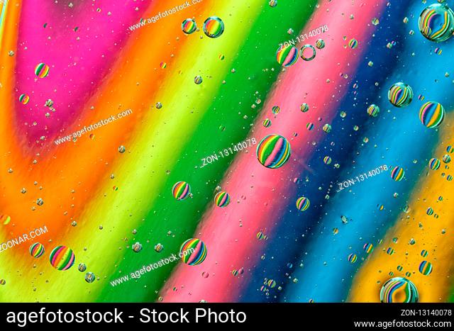 Abstract background of colorful oil drops on water surface