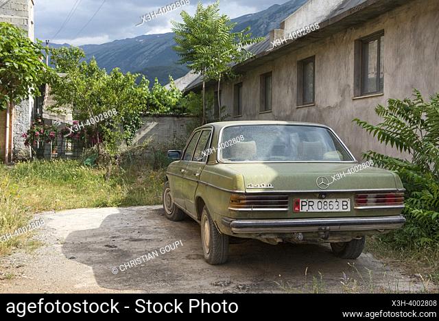 Old Mercedes in a street of Permet, mountain village on the banks of the Vjosë or Vjosa river, Gjirokaster District, Albania, Southeastern Europe