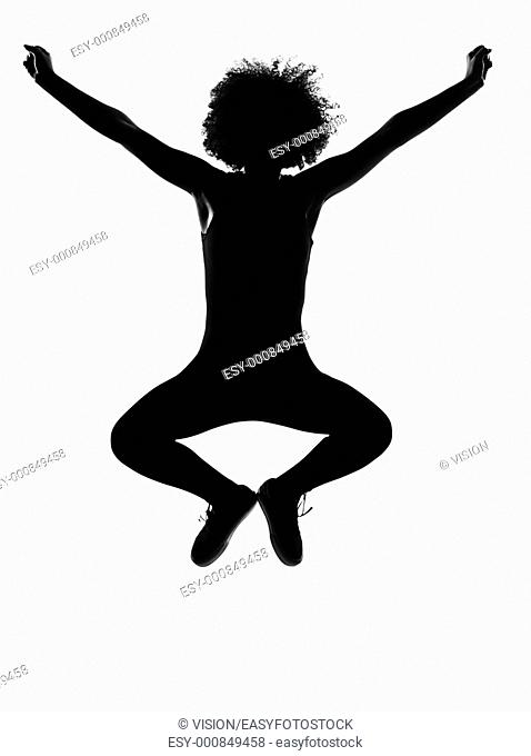 beautiful funny young afro american woman happy jumping in silhouette shadow on studio isolated white backgroung
