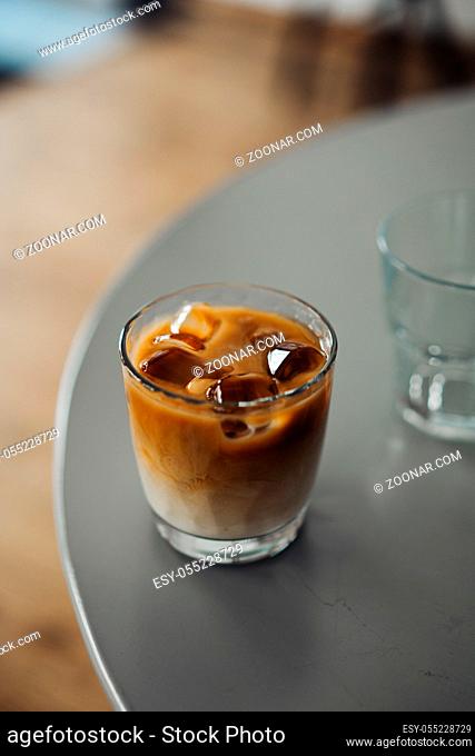 Glass Of Cold Coffee On The Table