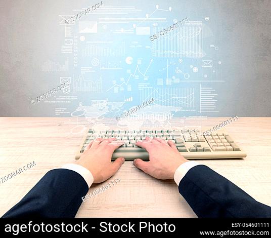 Elegant businessman hand typing with financial, report, graph, chart concept