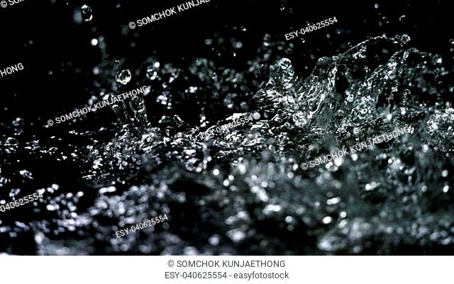 Water splash on black background color which represent clean and pure natural freshness of liquid for healthy drink or sparkling water