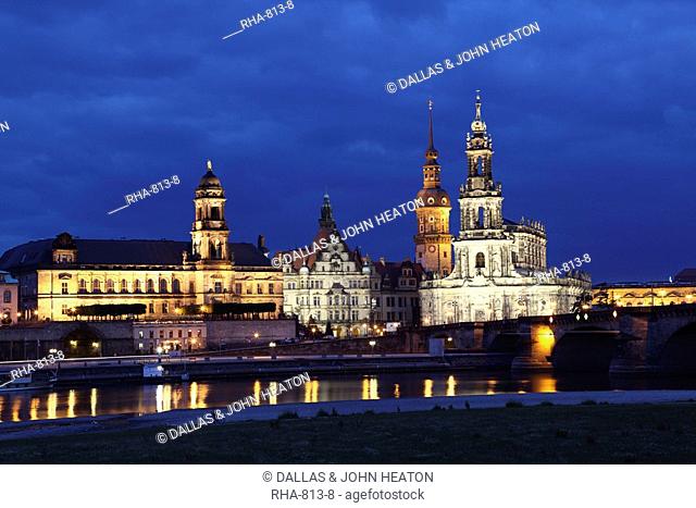 Evening view of city skyline including Hofkirche St. Trinity Cathedral, Hausmann Tower, Royal Palace Residenz Schloss and New State House, Dresden, Saxony