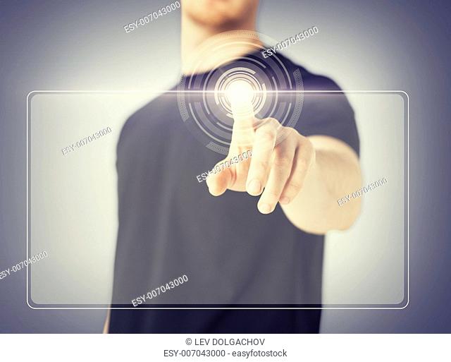 close up of male hand touching virtual screen