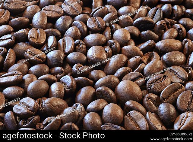 Close view of roasted coffee beans ready to be ground and infused