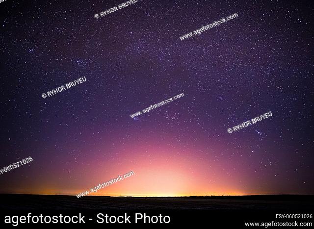 Real Night Sky Stars Background With Natural Colourful Sky Gradient. Sunset, Sunrise Light And Starry Sky. Yellow And Magenta Colors