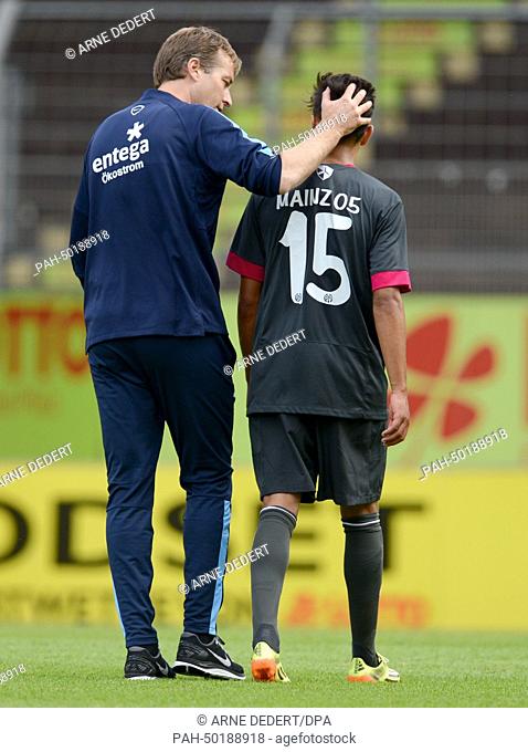 Mainz's head coach Kasper Hjulmand (L) talks to his player and two-time goal scorer Devante Parker after the 4-1 victory of the friendly soccer match between 1